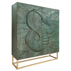 Estila Štýlová dvojdverová tyrkysová art deco barová skrinka Cumbria s vyrezávaným hadím motívom a zlatou kovovou konštrukciou 120 cm