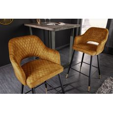 Estila Art deco zamatová barová stolička Fribourg v horčicovo žltej farbe s opierkami na čiernych nožičkách 104cm