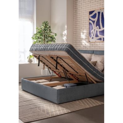 Modrá čalúnená dvojlôžková posteľ s úložným priestorom s roštom 180x200 cm Thessa Bold Line – Bonami Selection