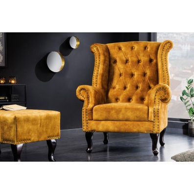 Estila Chesterfield kreslo Cella so zamatovým čalúnením v horčicovo žltej farbe s tmavohnedými masívnymi nožičkami 105cm