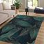 Prateľný koberec v petrolejovej farbe 120x180 cm Midnight Jungle – Mila Home