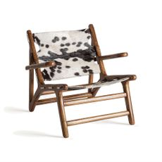 Estila Luxusné vintage kožené kreslo Huron so srsťou so zvieracím bielo čiernym vzorom s hnedou drevenou konštrukciou 82 cm