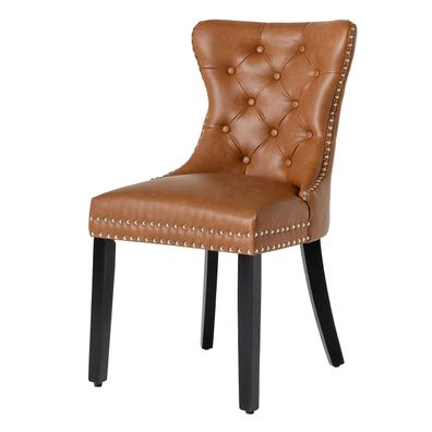 Estila Chesterfield jedálenská stolička Torino s čalúnením z hnedej kože s prešívaným operadlom s čiernymi drevenými nožičkami 93 cm
